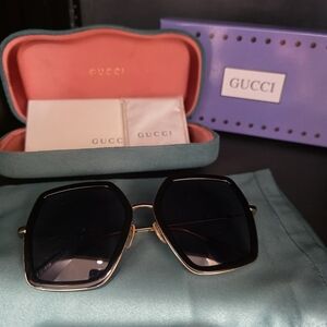 Gucci Women's Sunglasses with Black Lenses and Gold Frame